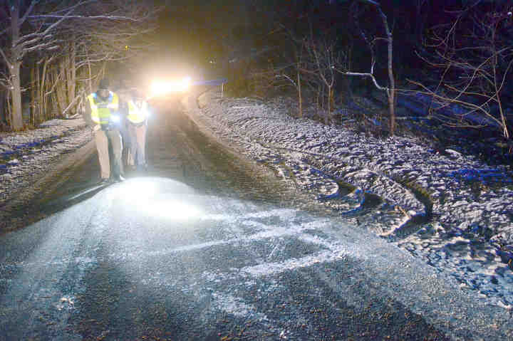 State Patrol Sgt. Ben Dennison and Trooper Laurna Curby investigate the scene of an ATV accident on Campbell Road. Anita Morgan, 54, of Hanoverton was injured in the crash.